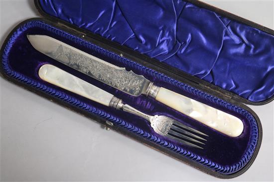 A cased Victorian mother of pearl handled silver serving knife and fork by James Deakins & Sons, Sheffield, 1894.